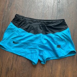Nike Women's Carolina Panthers Blue and Black Dri Fit Running Shorts